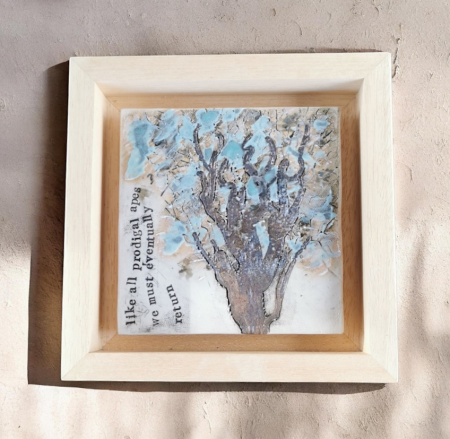 a ceramic artwork with poetry, in a frame