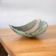 a raku pottery bowl with words